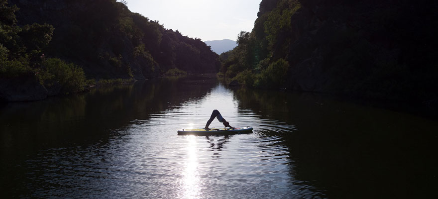 Beginner's Guide To Yoga Paddle Boarding