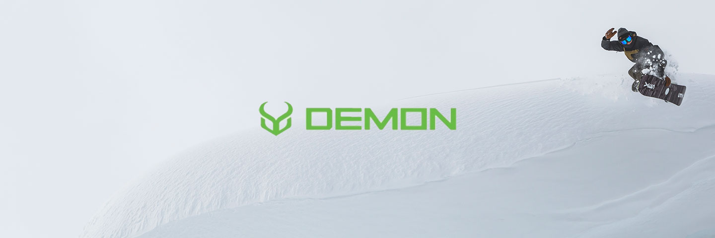 Demon logo with snowboarder in the background