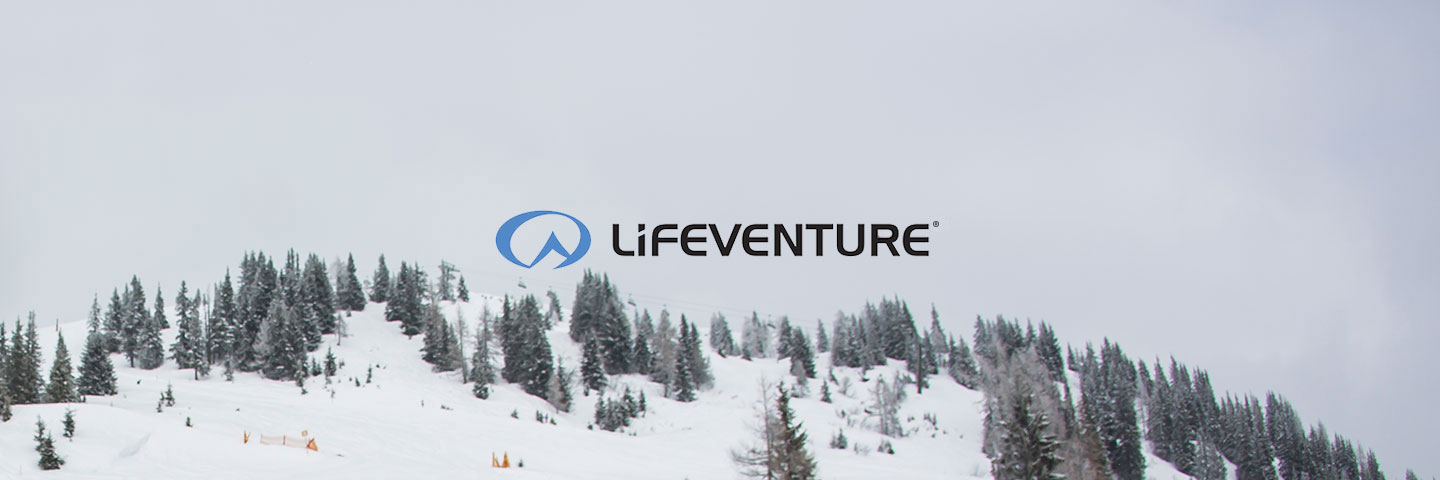 Lifeventure logo with snowy forest behind