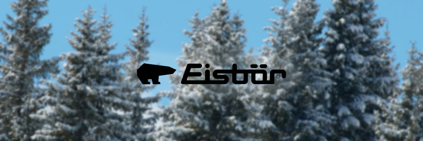 snowy trees with eisbar logo in the middle