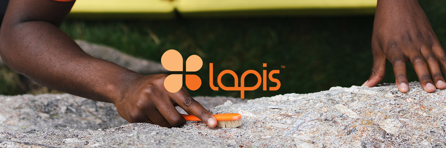 Lapis logo next to a climber brushing rock with a Lapis brush