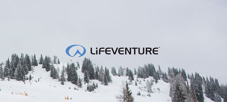 Lifeventure logo with snowy forest behind