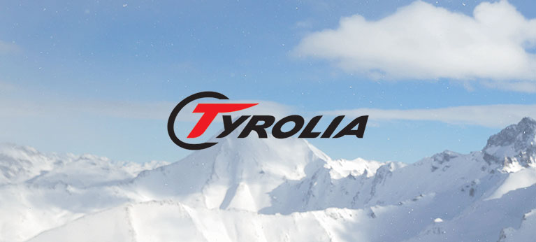 Tyrolia logo with snowy mountain peaks in the background