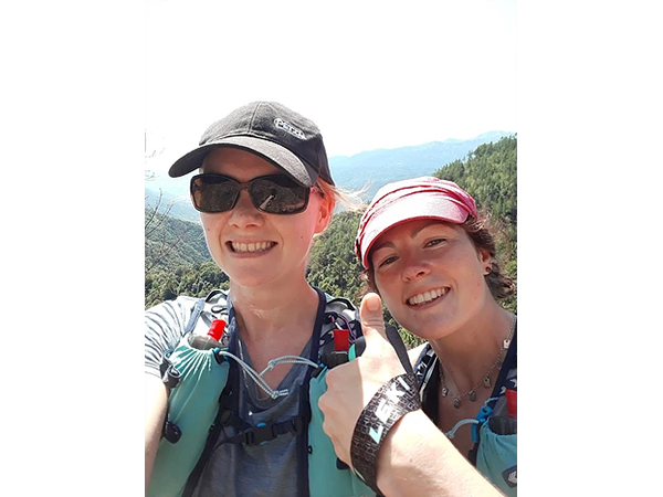 a selfie of two women running in Italy