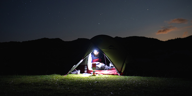 man camping at night