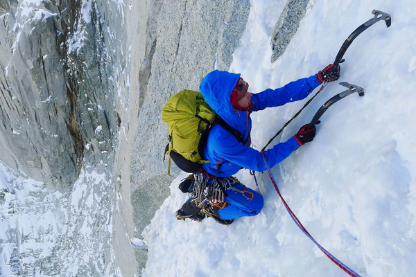 A man ice climbing