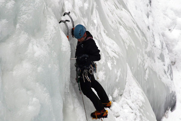 ice climber looking for gear