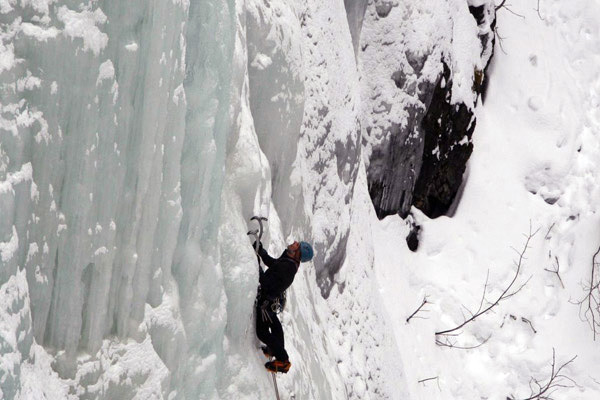 ice climber on ice wall