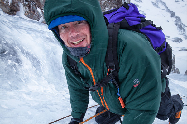 ice climber smiling at camera