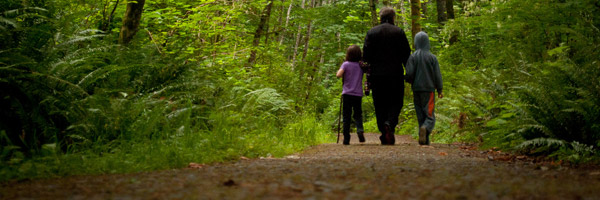 A family walking through woods